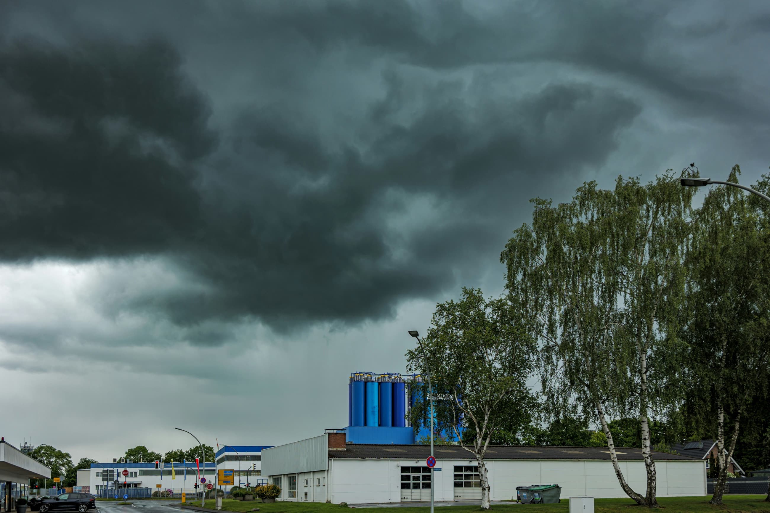 Storm clouds forming over a commercial roof