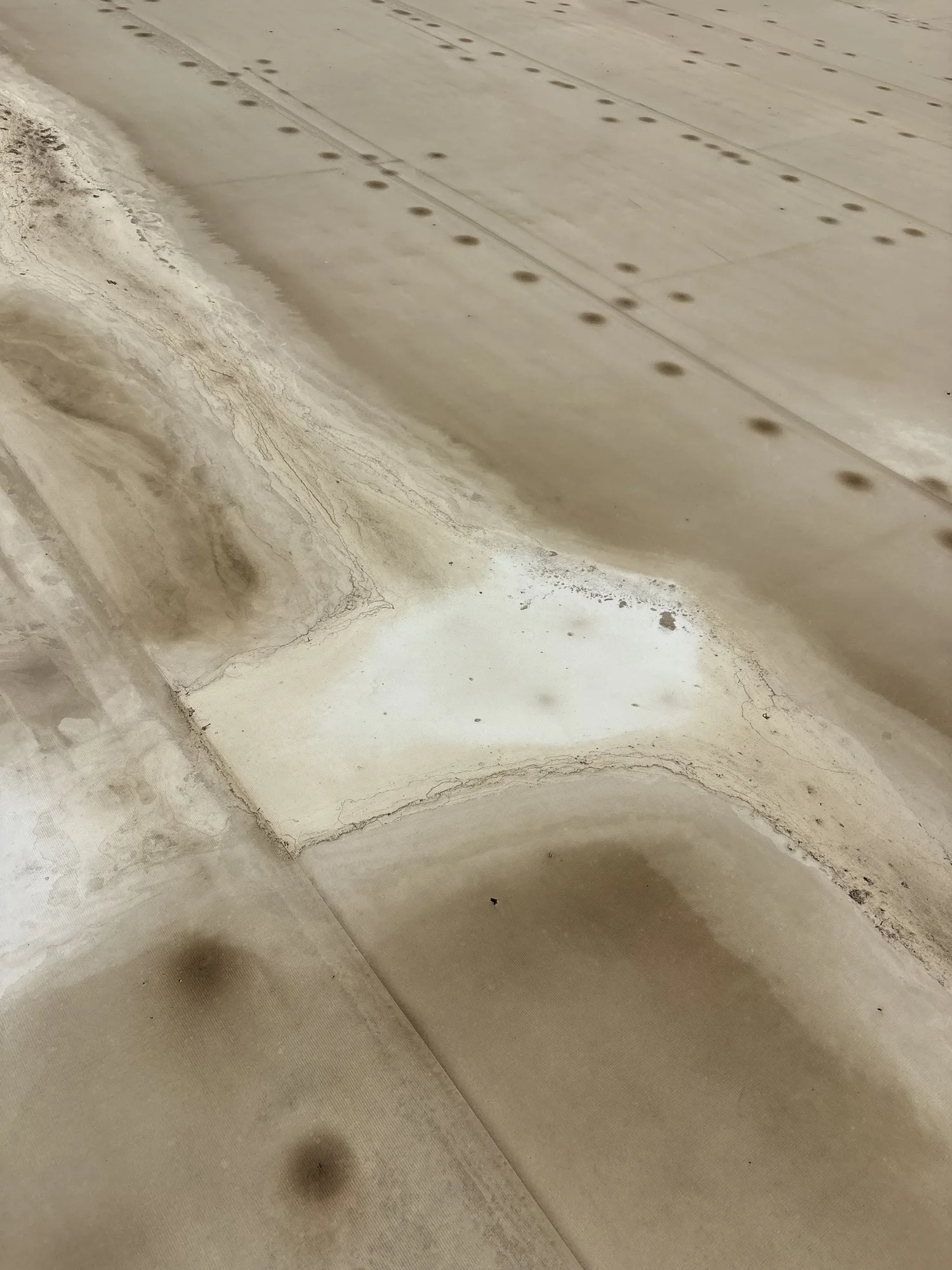 Existing membrane and drainage transition on a Bakersfield commercial roof