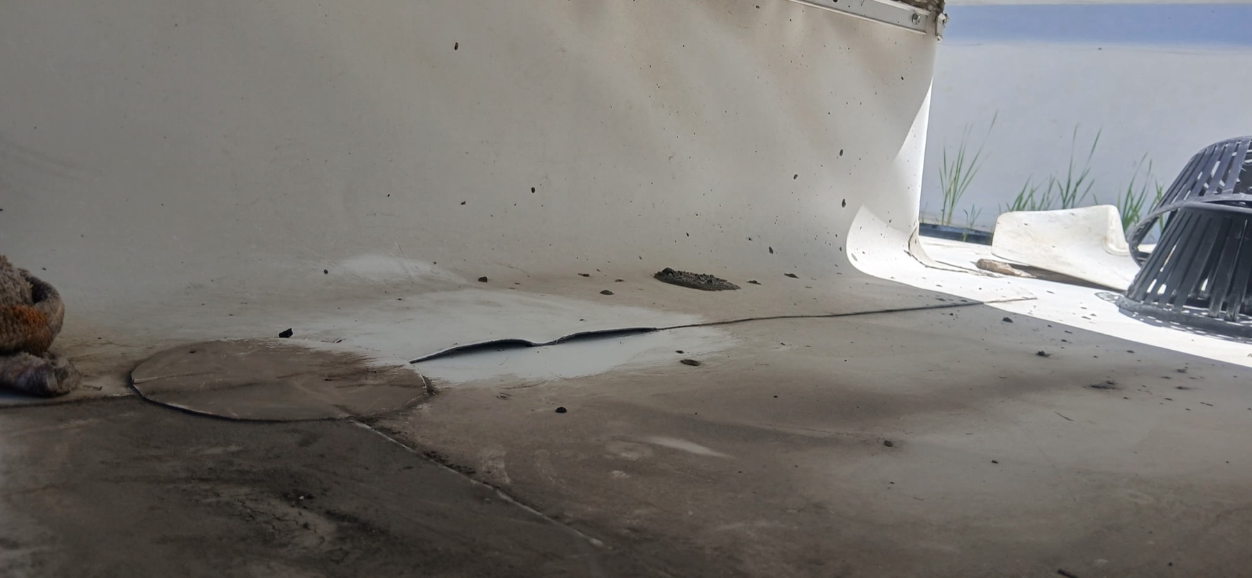 Low-slope restaurant roof membrane at a curb transition during completed leak repair work.