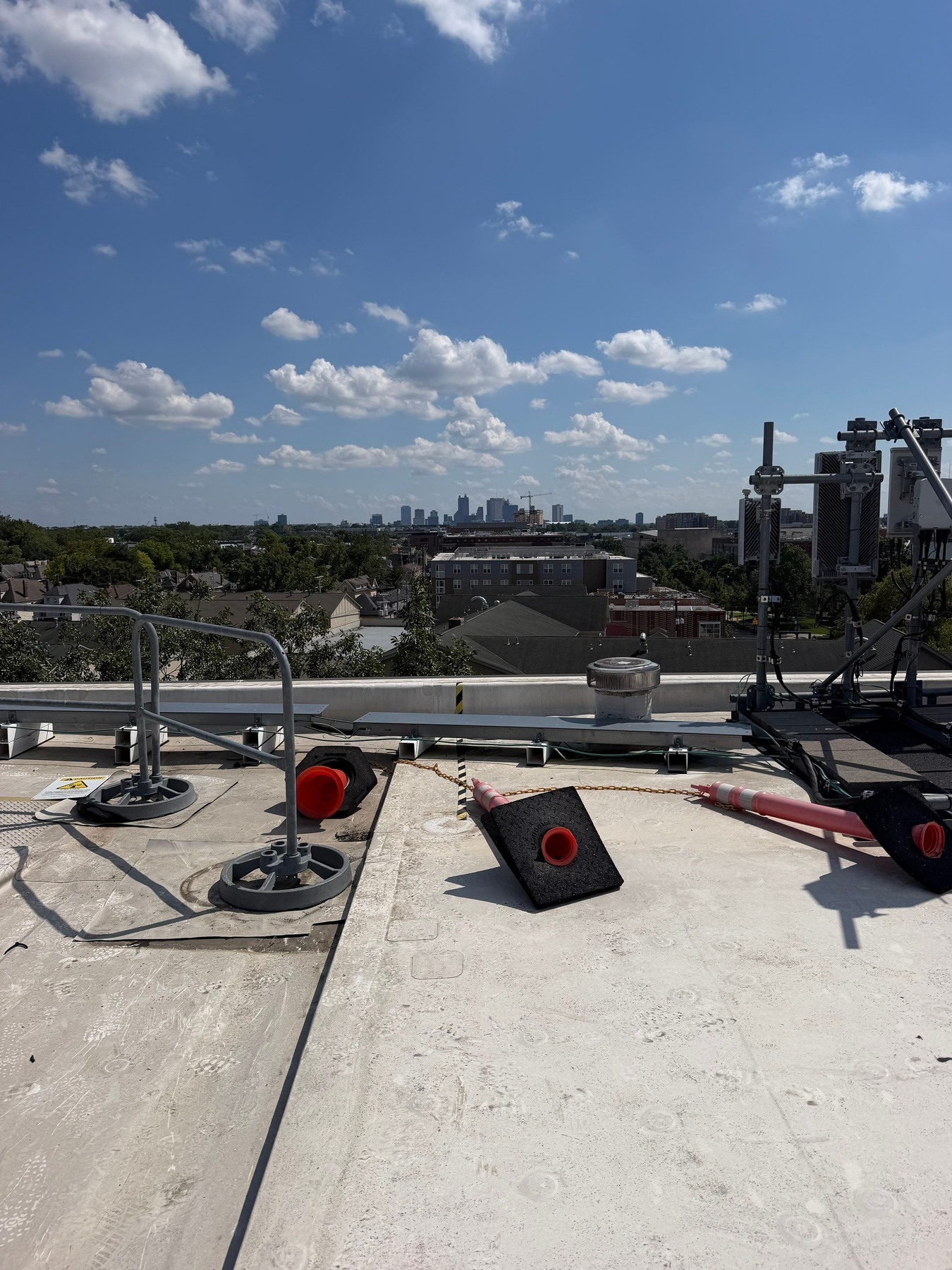 The apartment roof perimeter and open TPO field during the service visit.